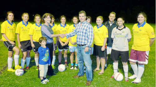 Anthony McPhee of Charter Partners congratulates Gympie soccer mum Jane Gomes on her win. The Miners side conducted a raffle to raise needed funds for their season. Anthony McPhee of Charter Partners congratulates Gympie soccer mum Jane Gomes on her win. The Miners side conducted a raffle to raise needed funds for their season.